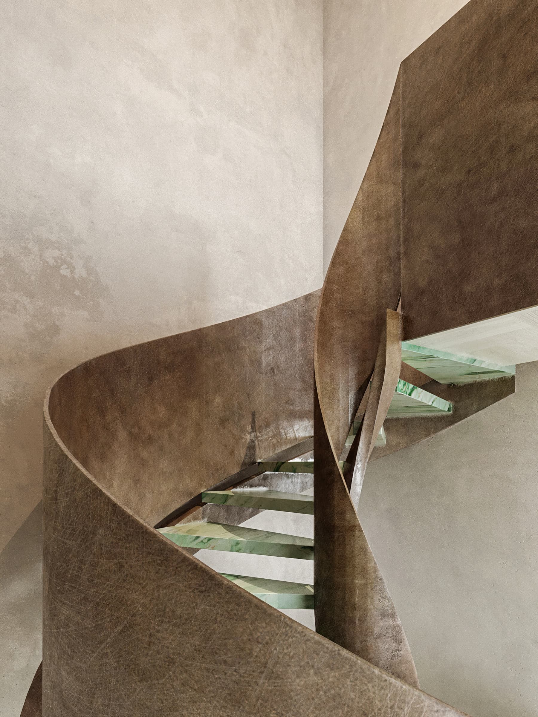 Dramatic staircase with herringbone flooring
